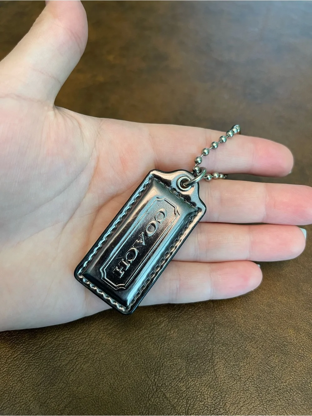 Coach silvery hangtag